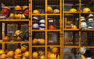 Hard hats in storage for blog about workers’ compensation exclusive remedy